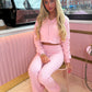 Pink cropped zip hoodie and bell bottom trouser set