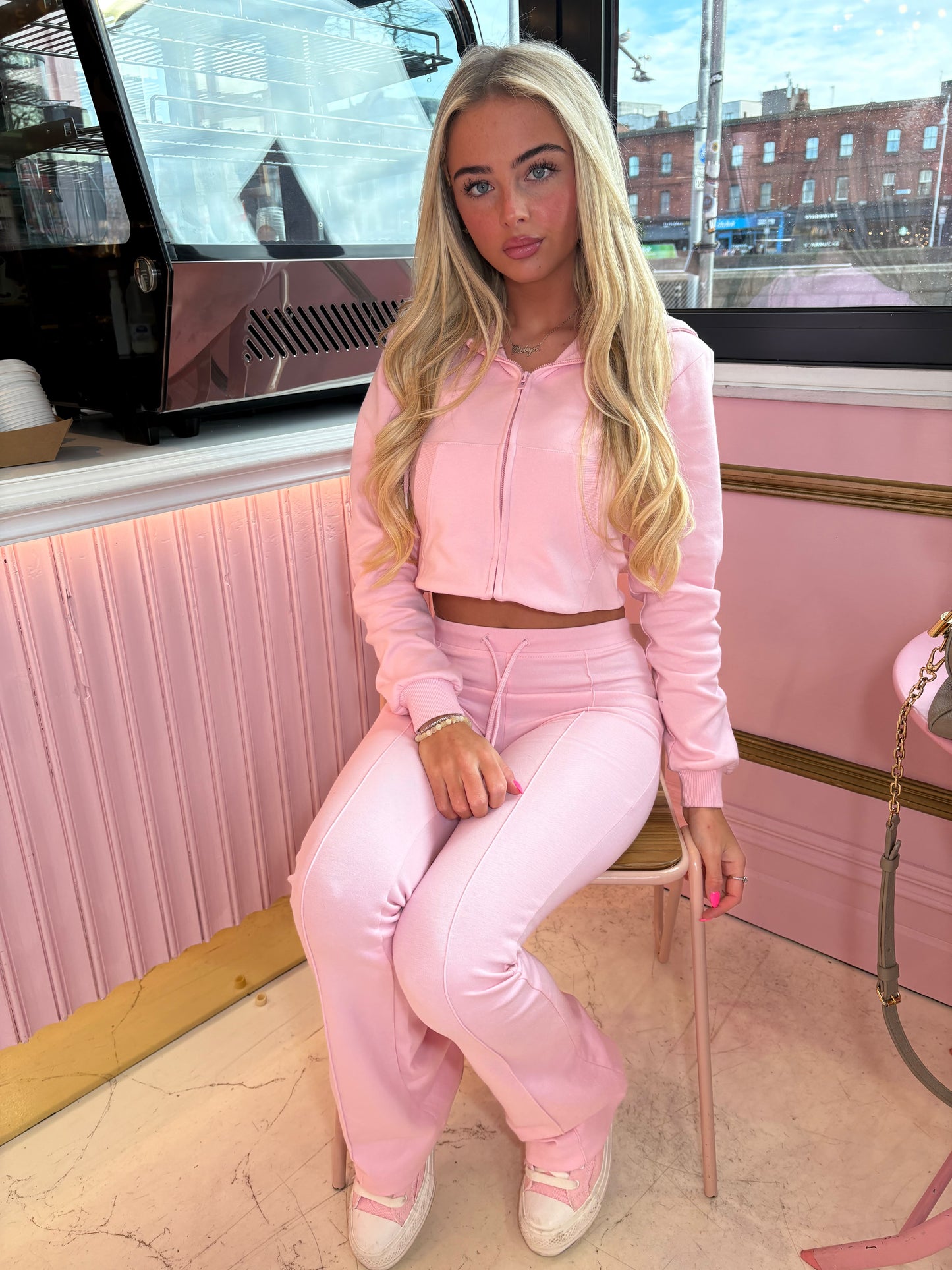 Pink cropped zip hoodie and bell bottom trouser set