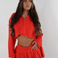 Red tailored zip up jacket and pleated skirt set