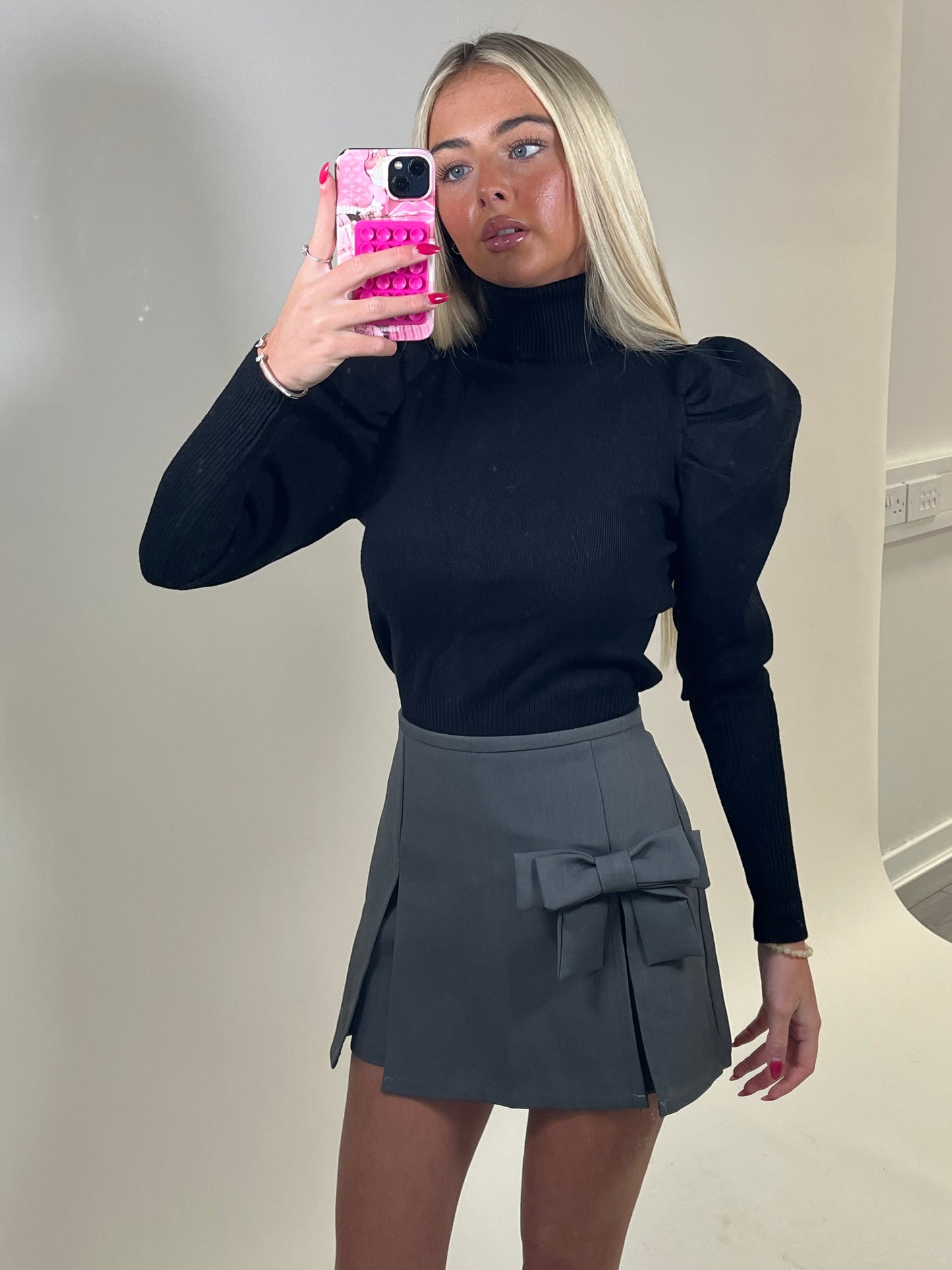 Black high neck puff sleeve ribbed jumper