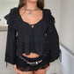 Black cropped ruffle blouse