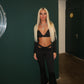 Black buckled top and flared bottoms co-ord