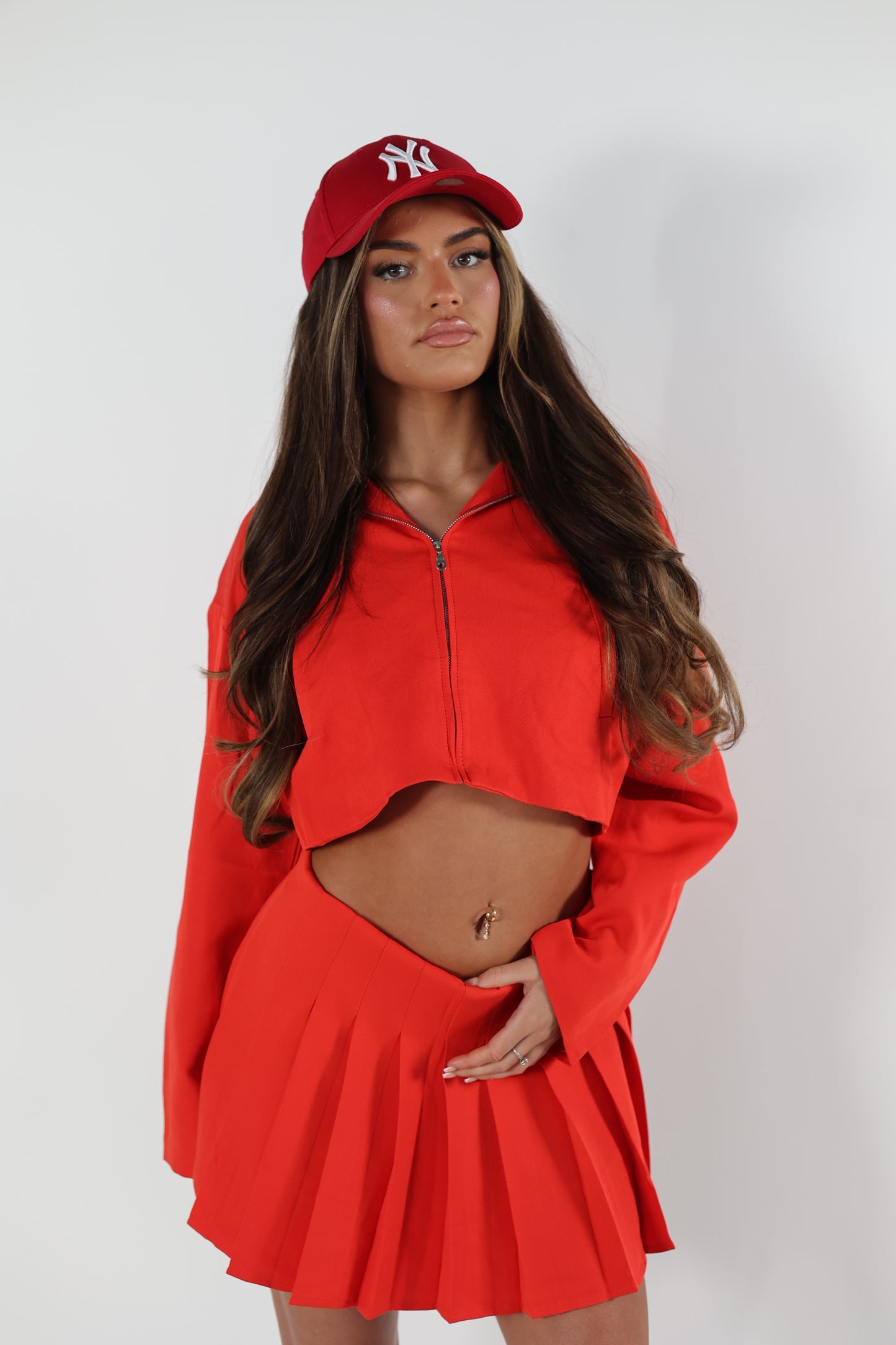 Red tailored zip up jacket and pleated skirt set