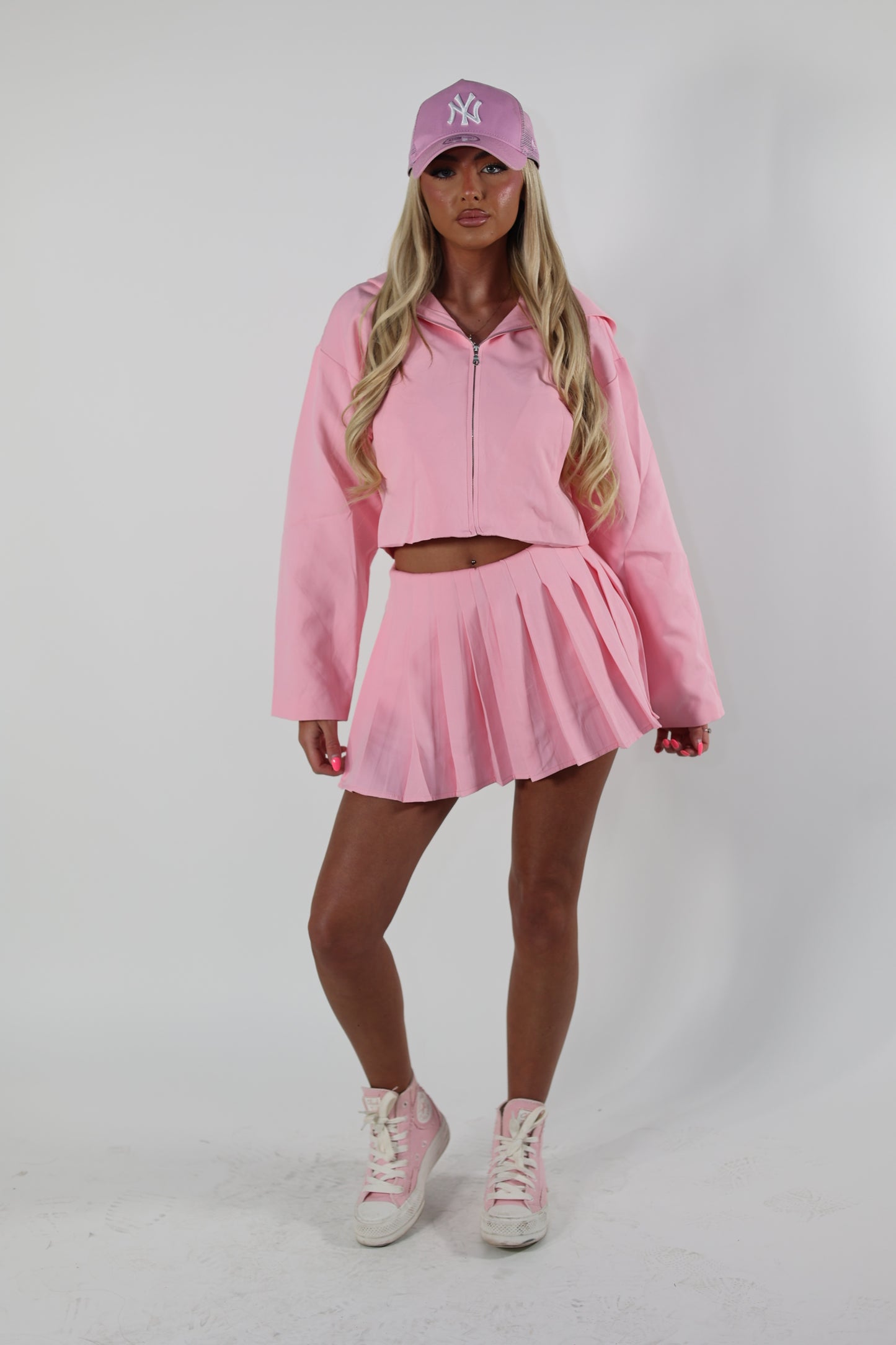 Pink tailored zip up jacket and pleated skirt set
