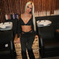 Black buckled top and flared bottoms co-ord