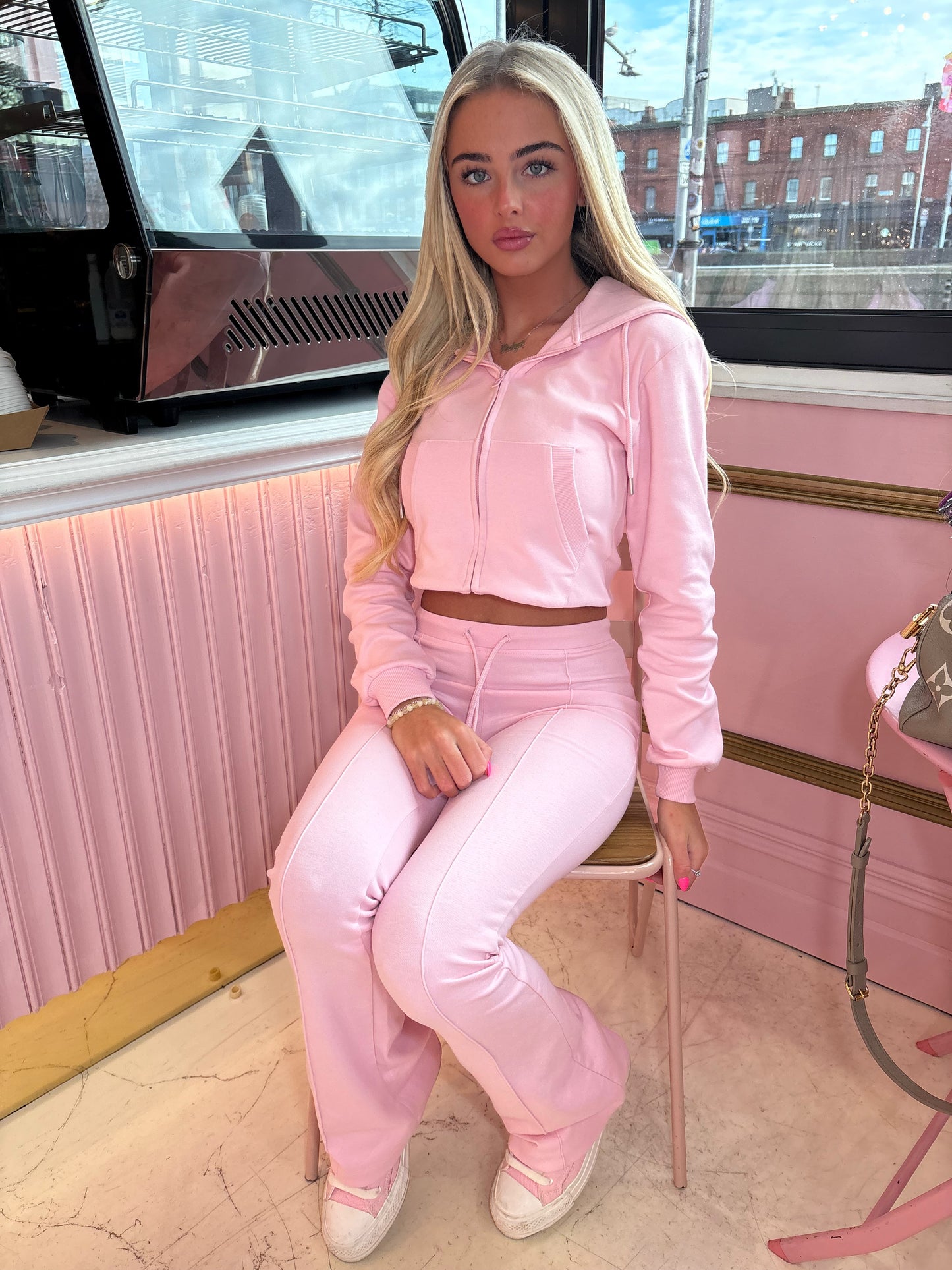 Pink cropped zip hoodie and bell bottom trouser set