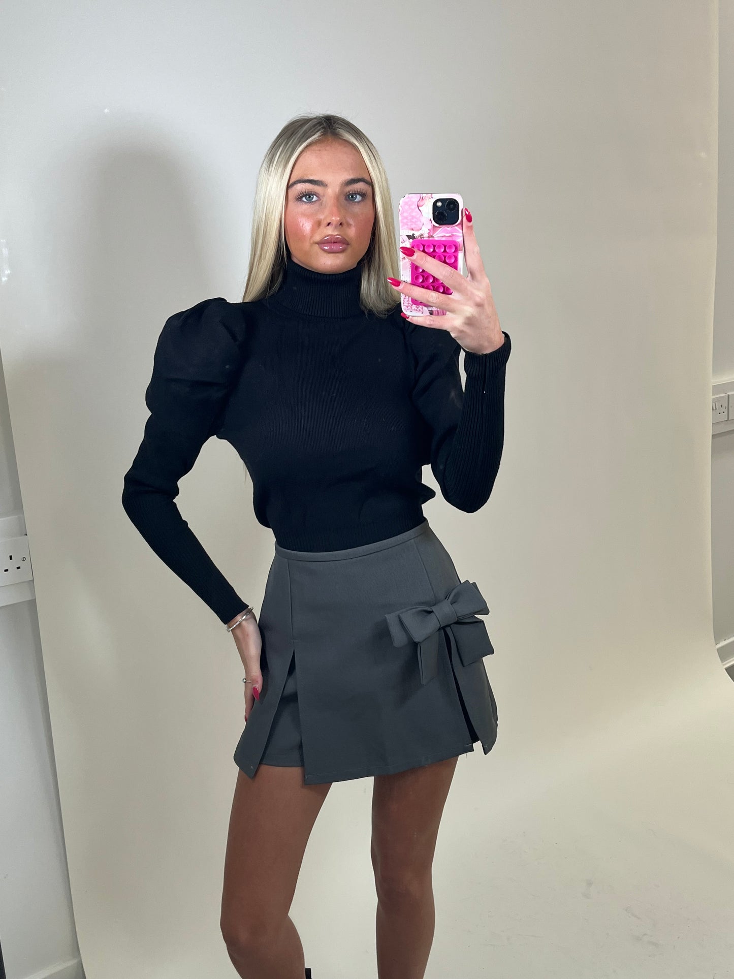 Black high neck puff sleeve ribbed jumper