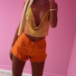 Orange frayed hem shorts